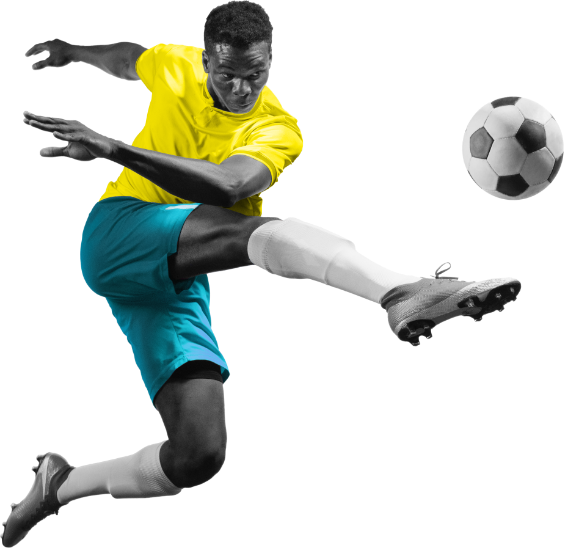 Spieler in gelbem Trikot und blauen Shorts in einer Fußballaktion mit Ball.